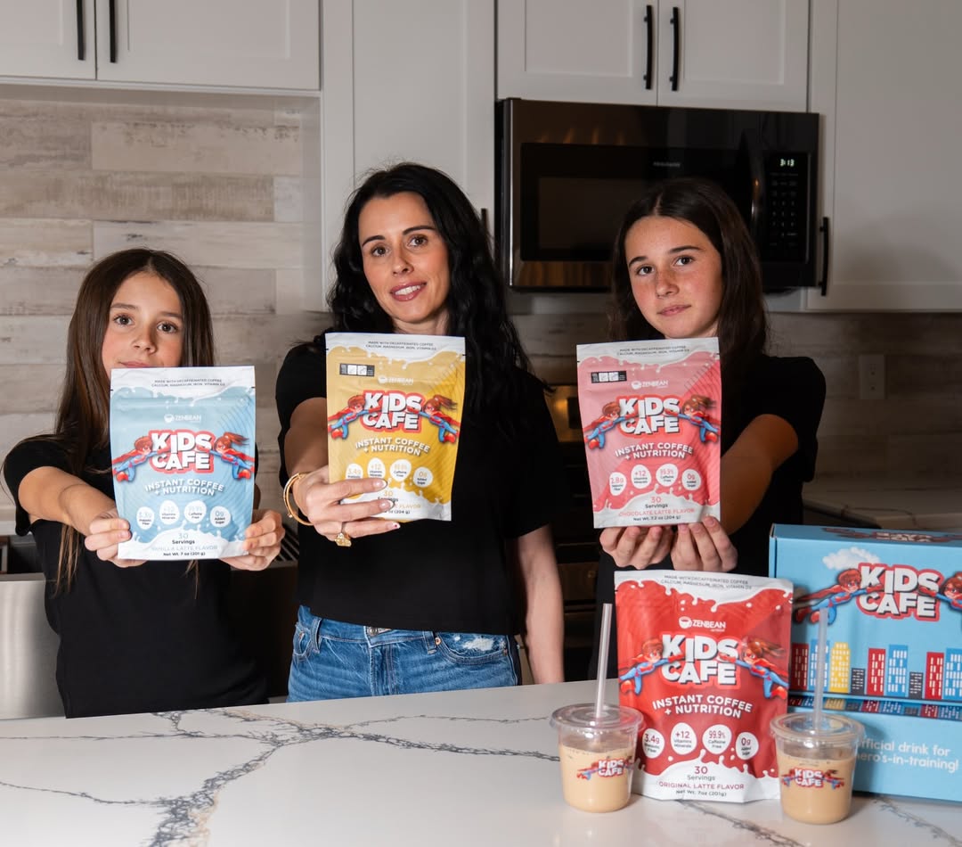 Hollie Mancini and her two daughters holding Kids Cafe pouches