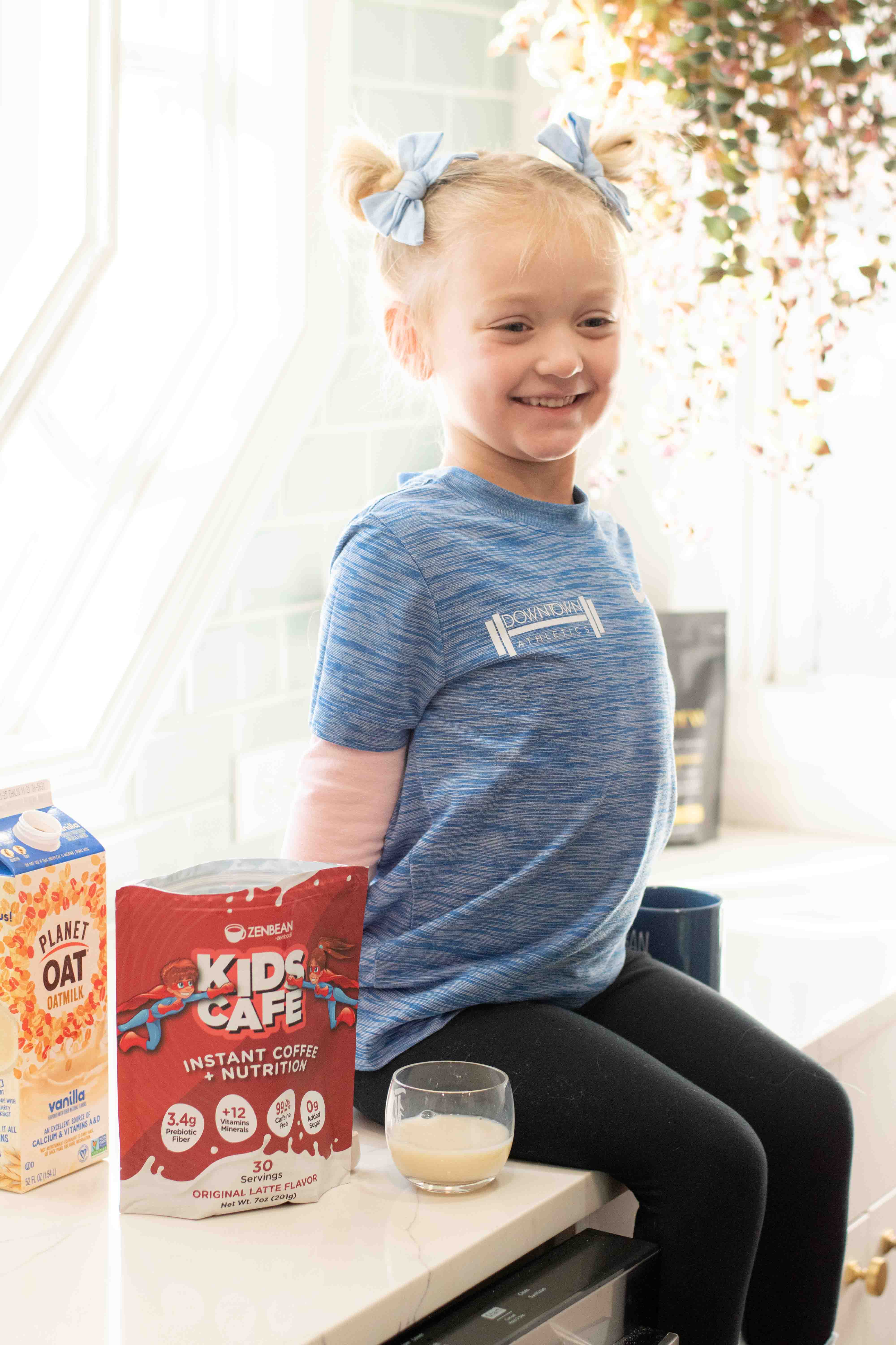 Girl holding mug and smiling