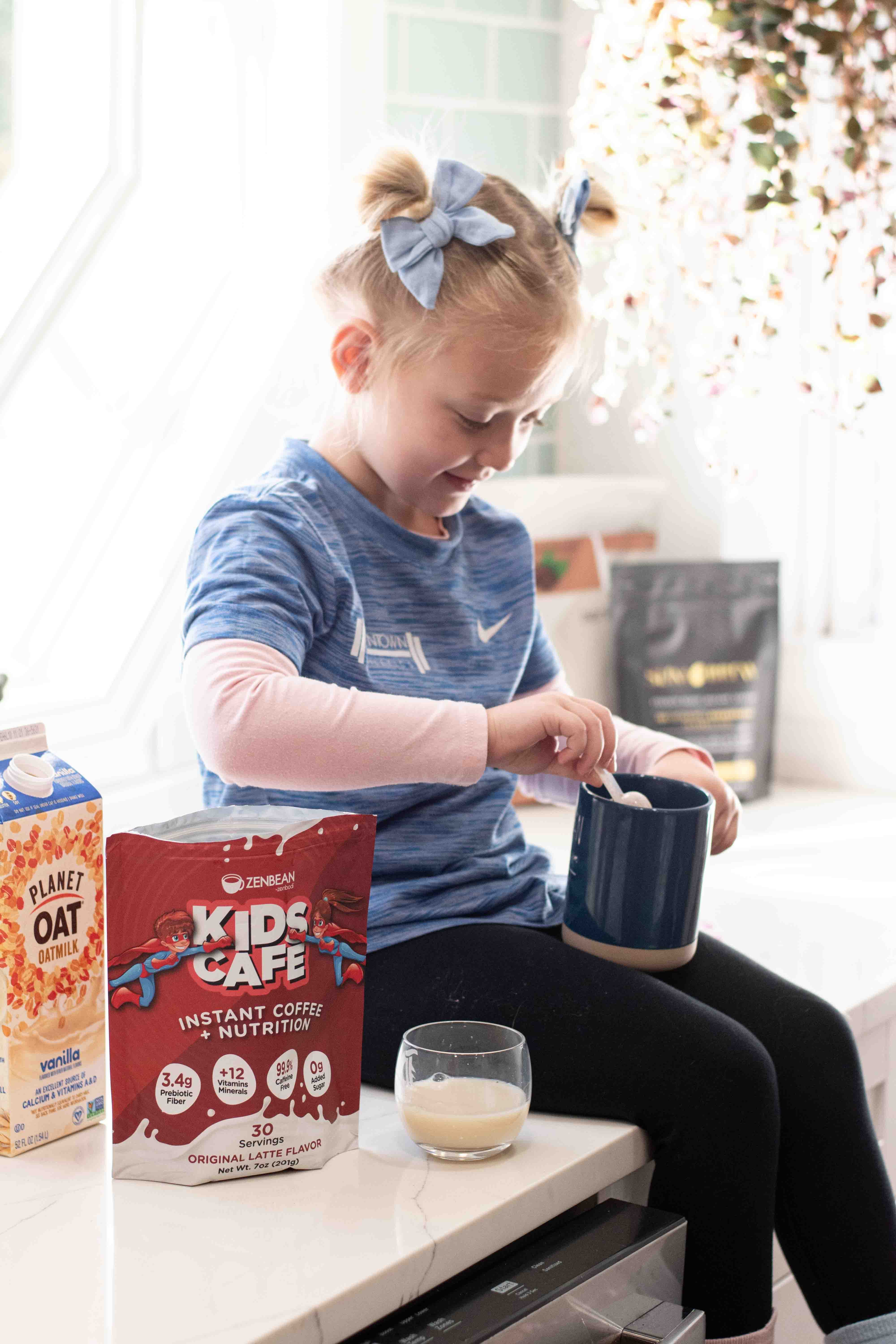 Girl scooping Kids Cafe powder