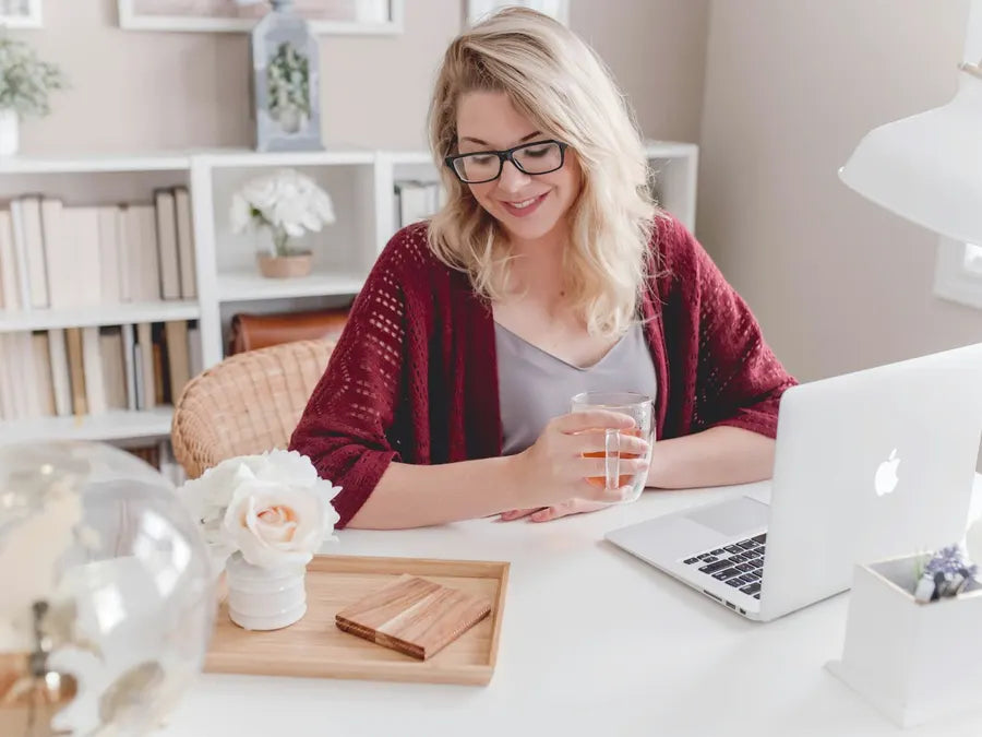 Woman smiling while working in the morning